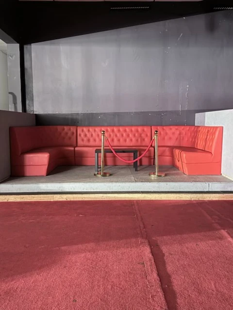 Red booth seating after cleanup